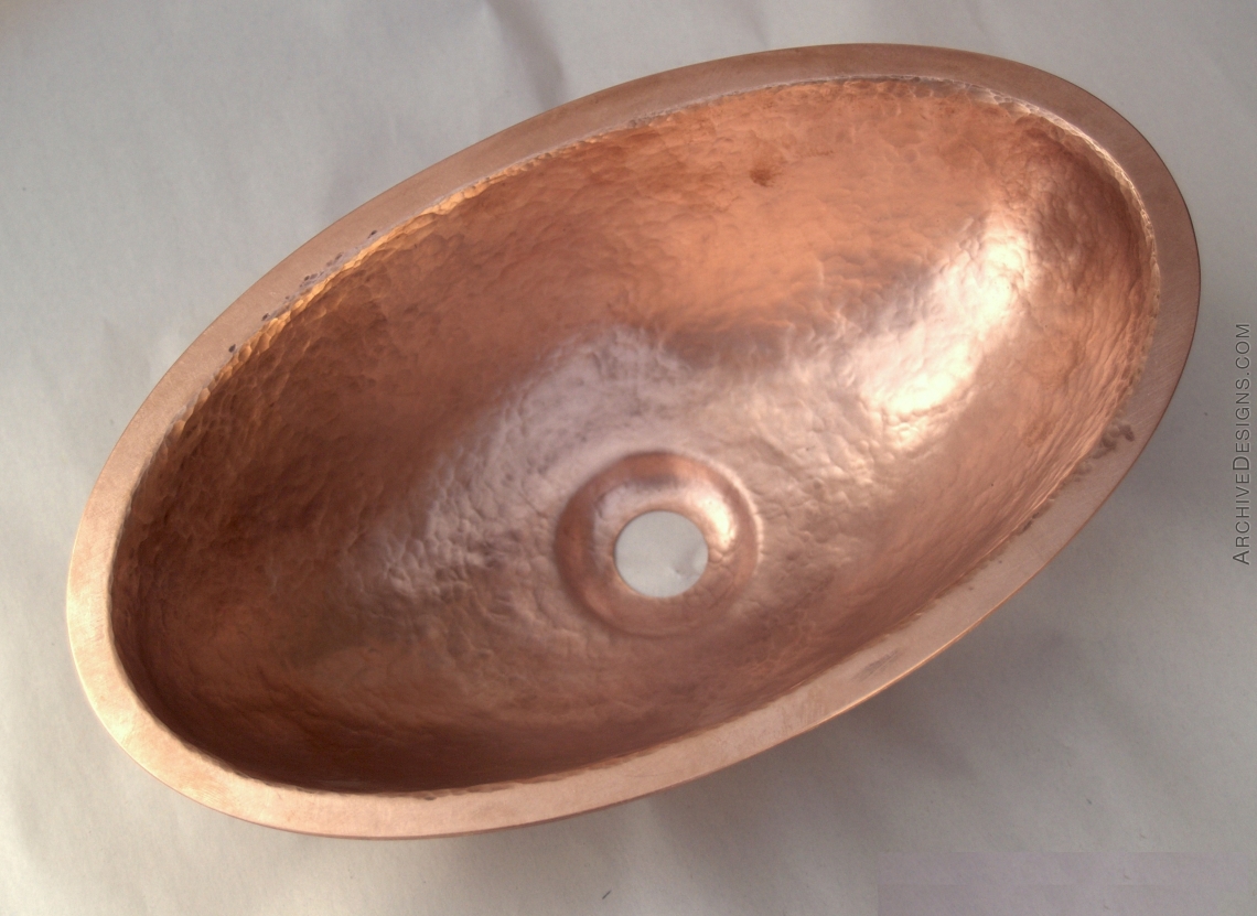 Very small hammered copper sink for a client's private jet.